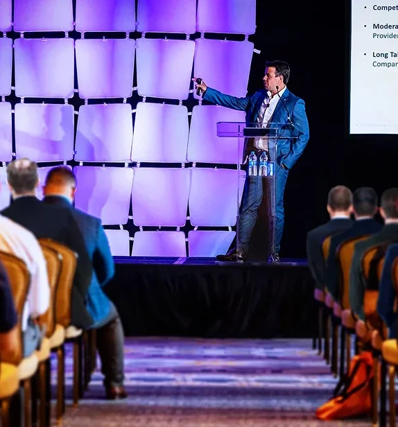 Brendan Egan speaking at an event